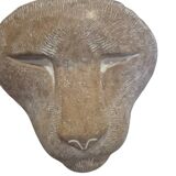 Sculpture of a lion in stone by Islay Grimes.