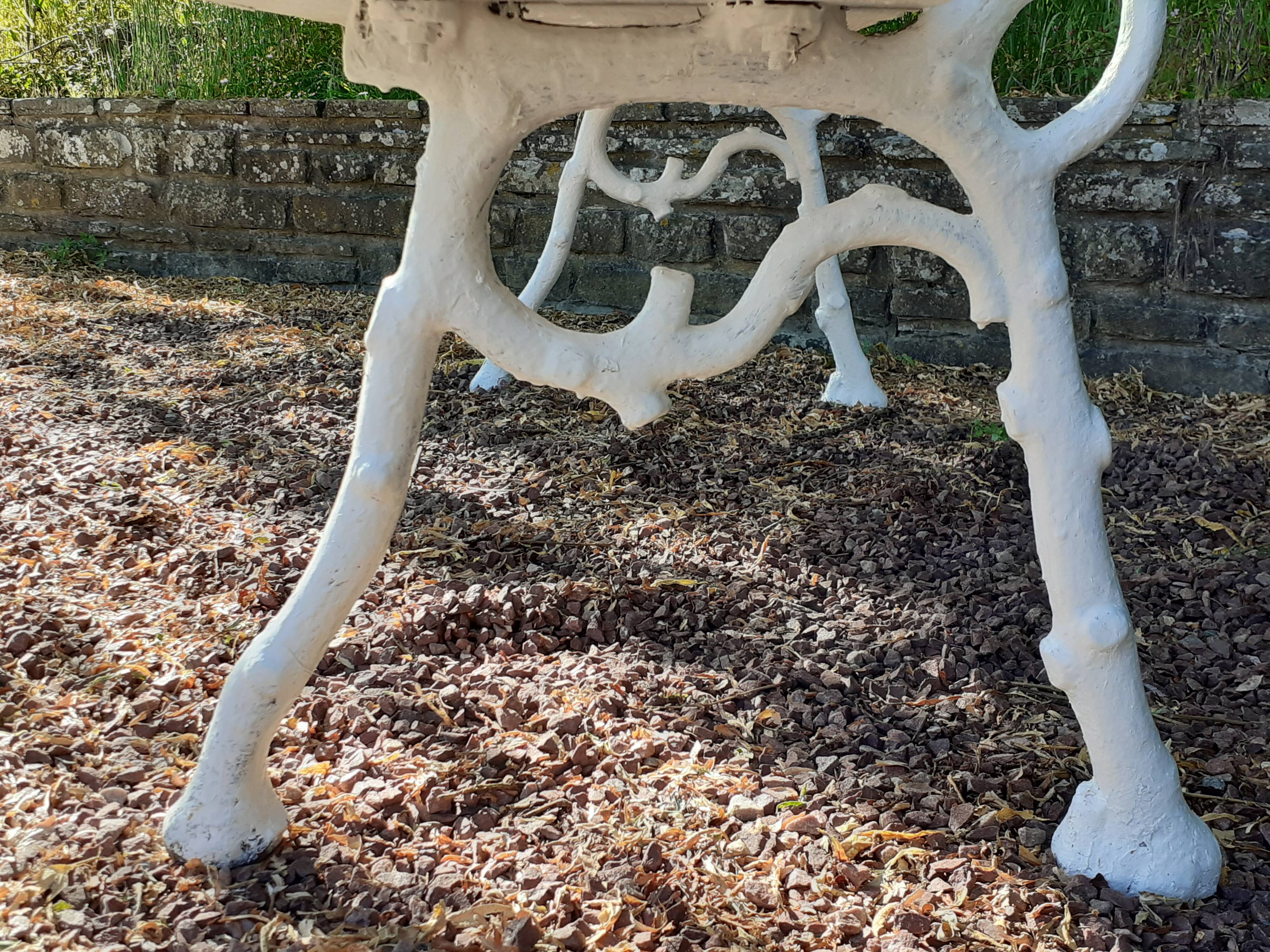 Old garden bench with cast iron feet and wooden planks
