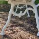 Old garden bench with cast iron feet and wooden planks