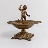 Vintage brass ashtray from the 1940s with a nude boy figurine on a footed base.