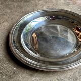 Round, hollow silver-plated metal dish
