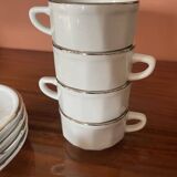 Four porcelain "bistro" cups and saucers