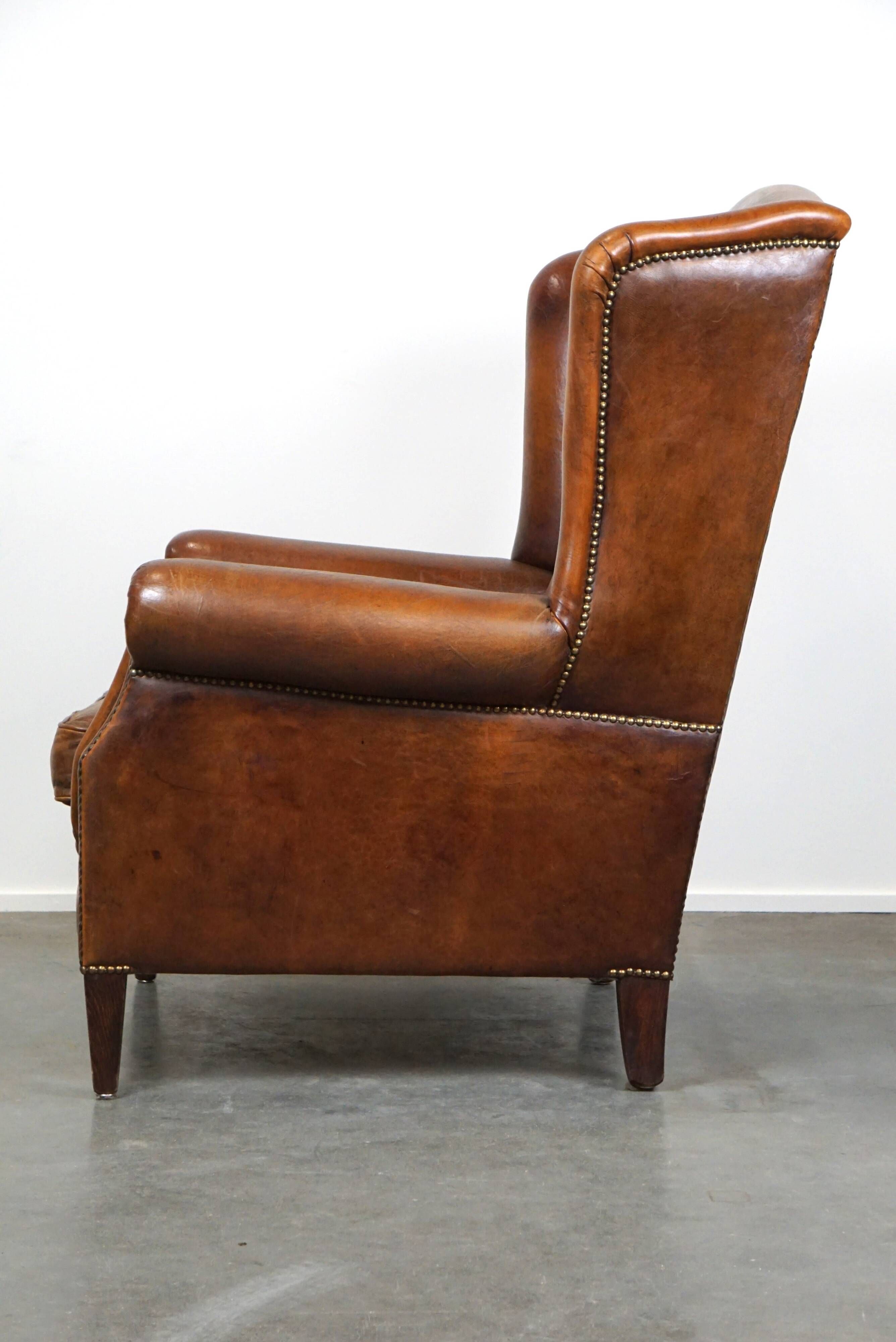 Especially comfortable wingback chair made of sheepskin leather, stunning colors