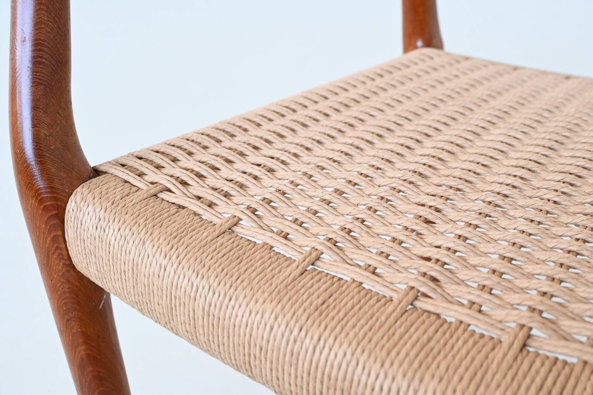 Niels Otto Moller model 66 armchairs teak and paper cord Denmark 1974