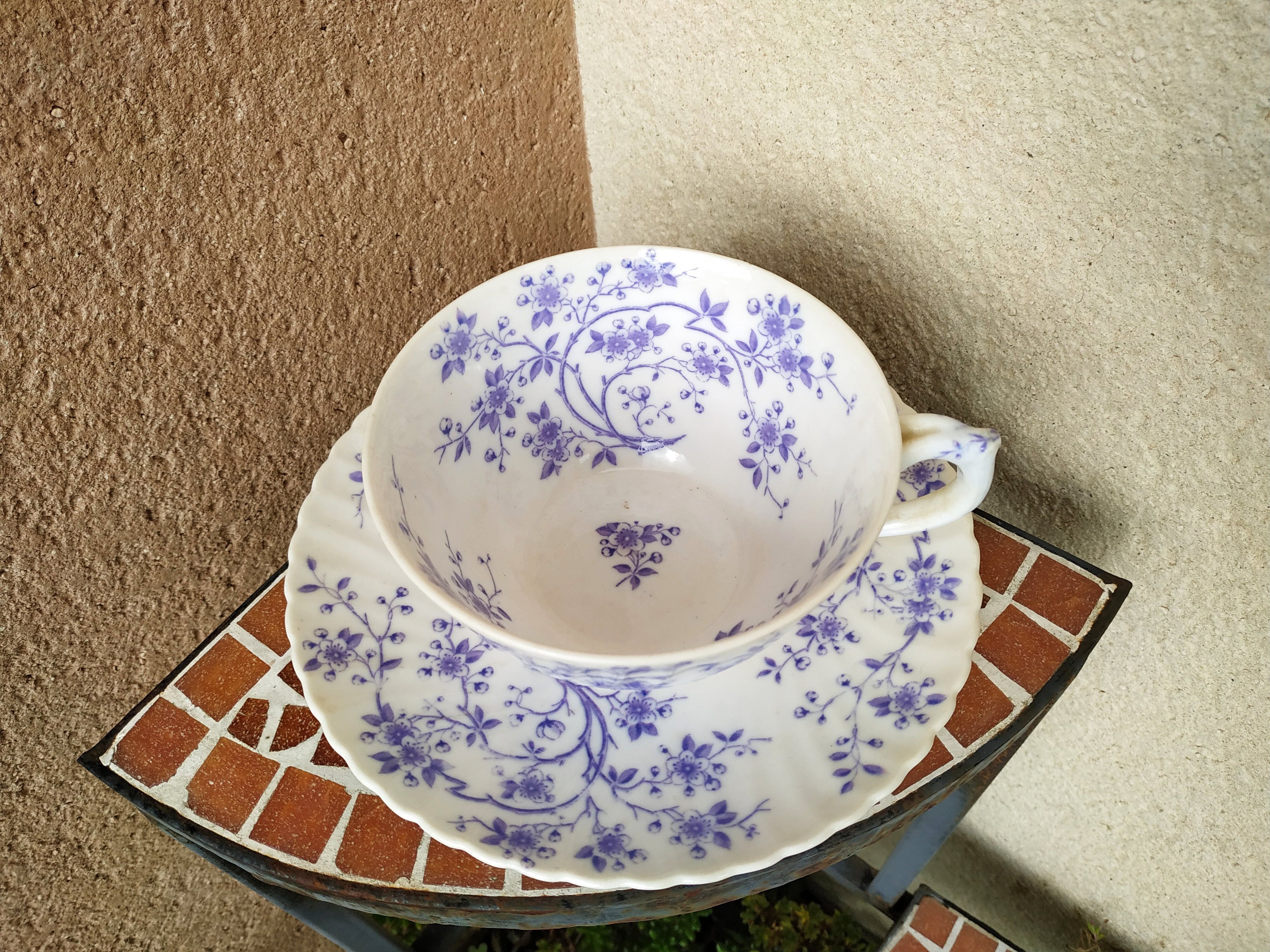 Ancient porcelain cup from eastern France with Mauve Fleurettes