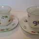 Two cups and saucers in fine porcelain, orchard model.