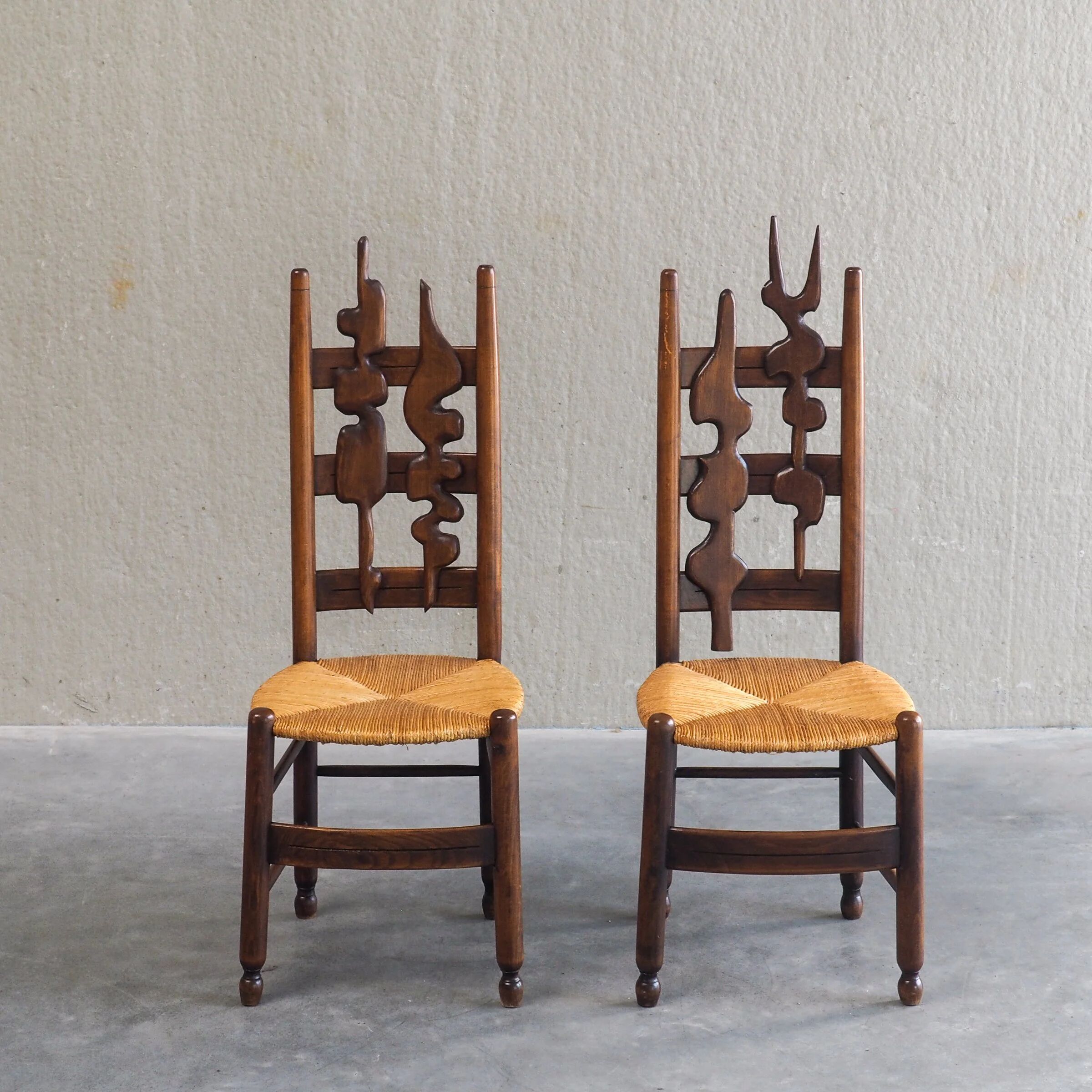2 sculptural brutalist high-back chairs