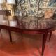Directoire period extendable dining table in mahogany with a band.