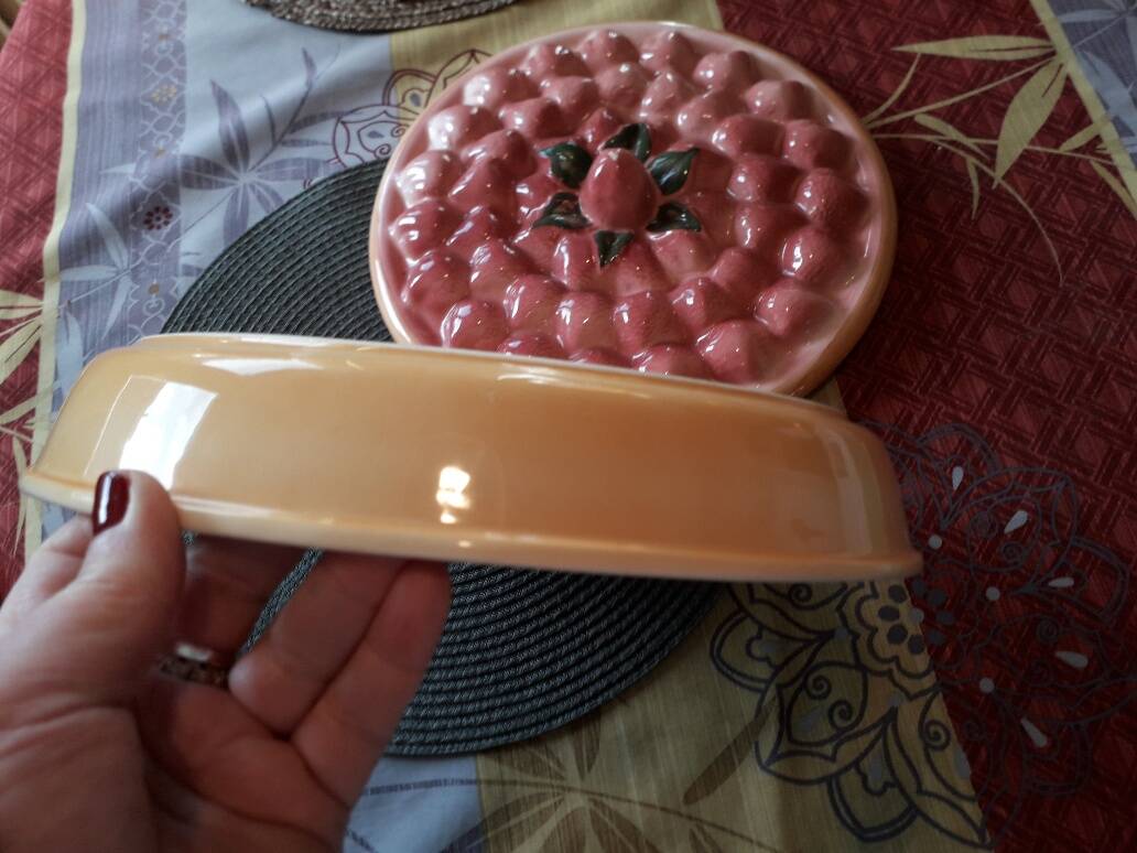 Glazed ceramic dessert plate with strawberry design.