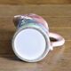 Vintage carafe in colorful fish slip