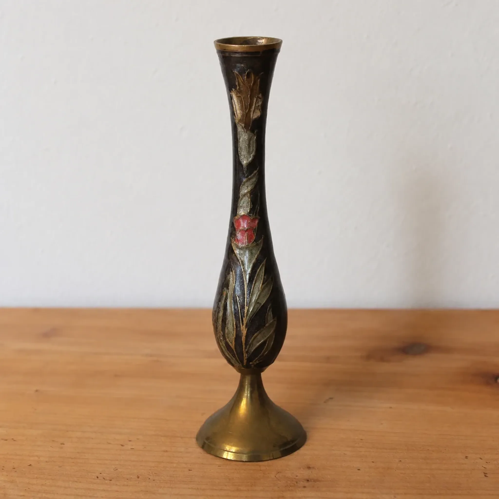 Vintage brass soliflore vase with black, red, and green floral decoration – H 18 cm