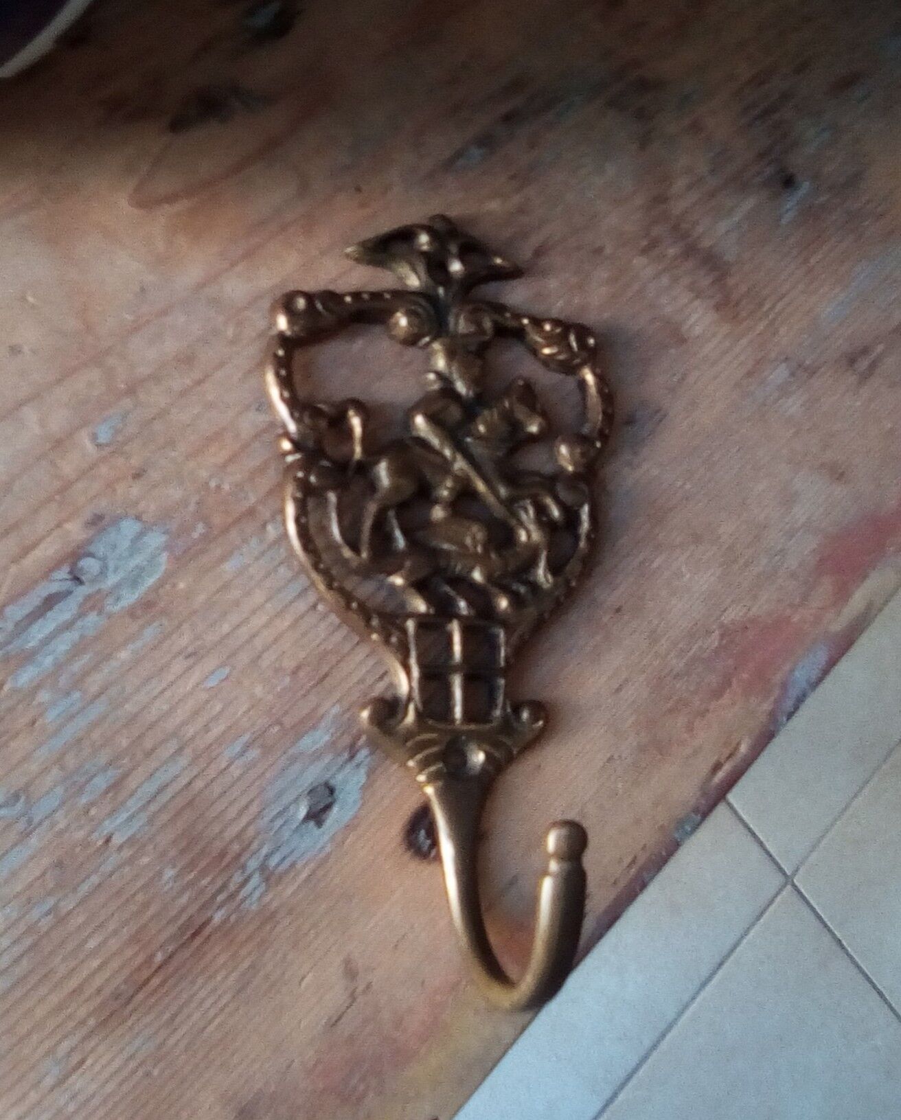 Old brass patère coat rack