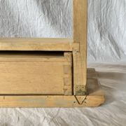 Old small hanging shelf in solid wood