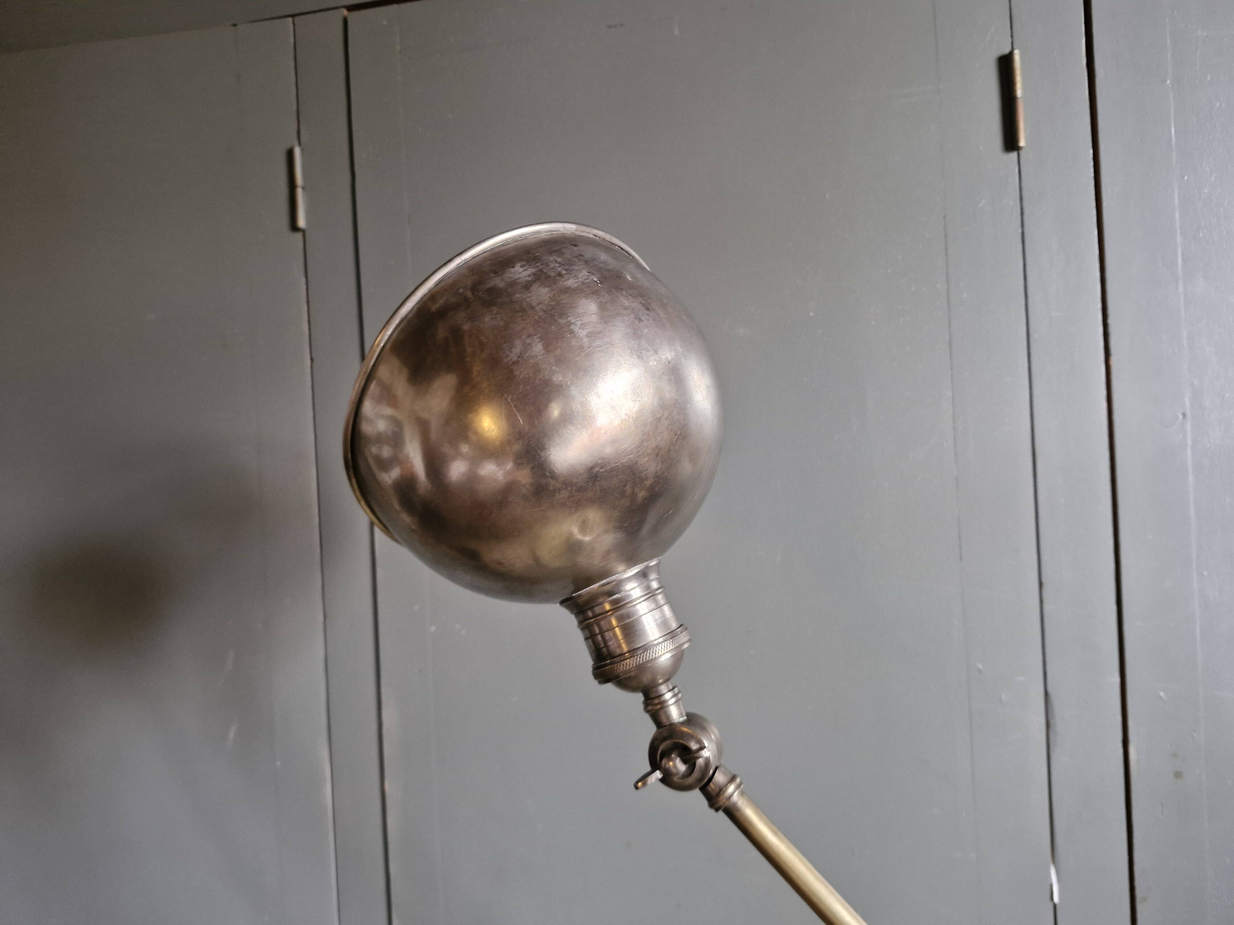 Old adjustable industrial lamp in bronze with 2 arms.