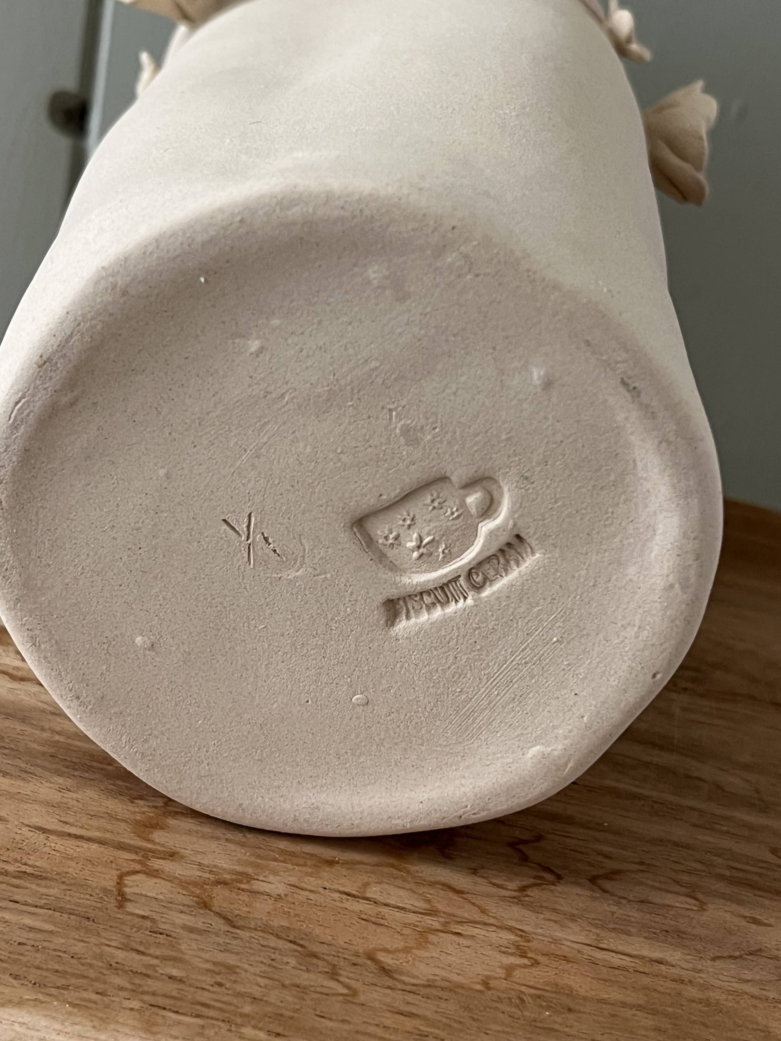 Stoneware vase with relief flowers