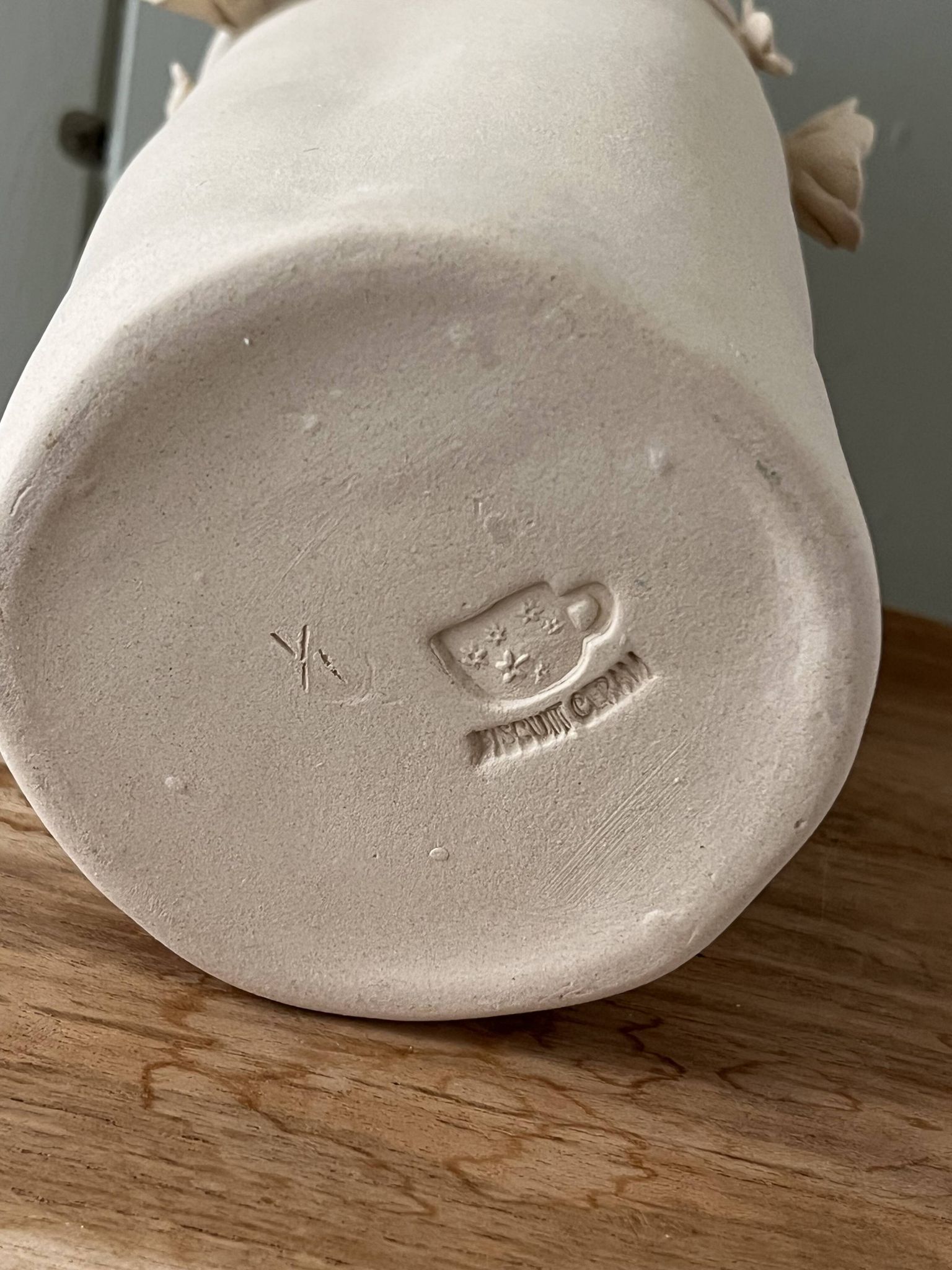 Stoneware vase with relief flowers