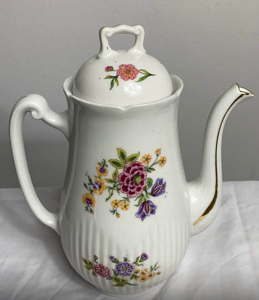 Antique porcelain teapot and sugar bowl