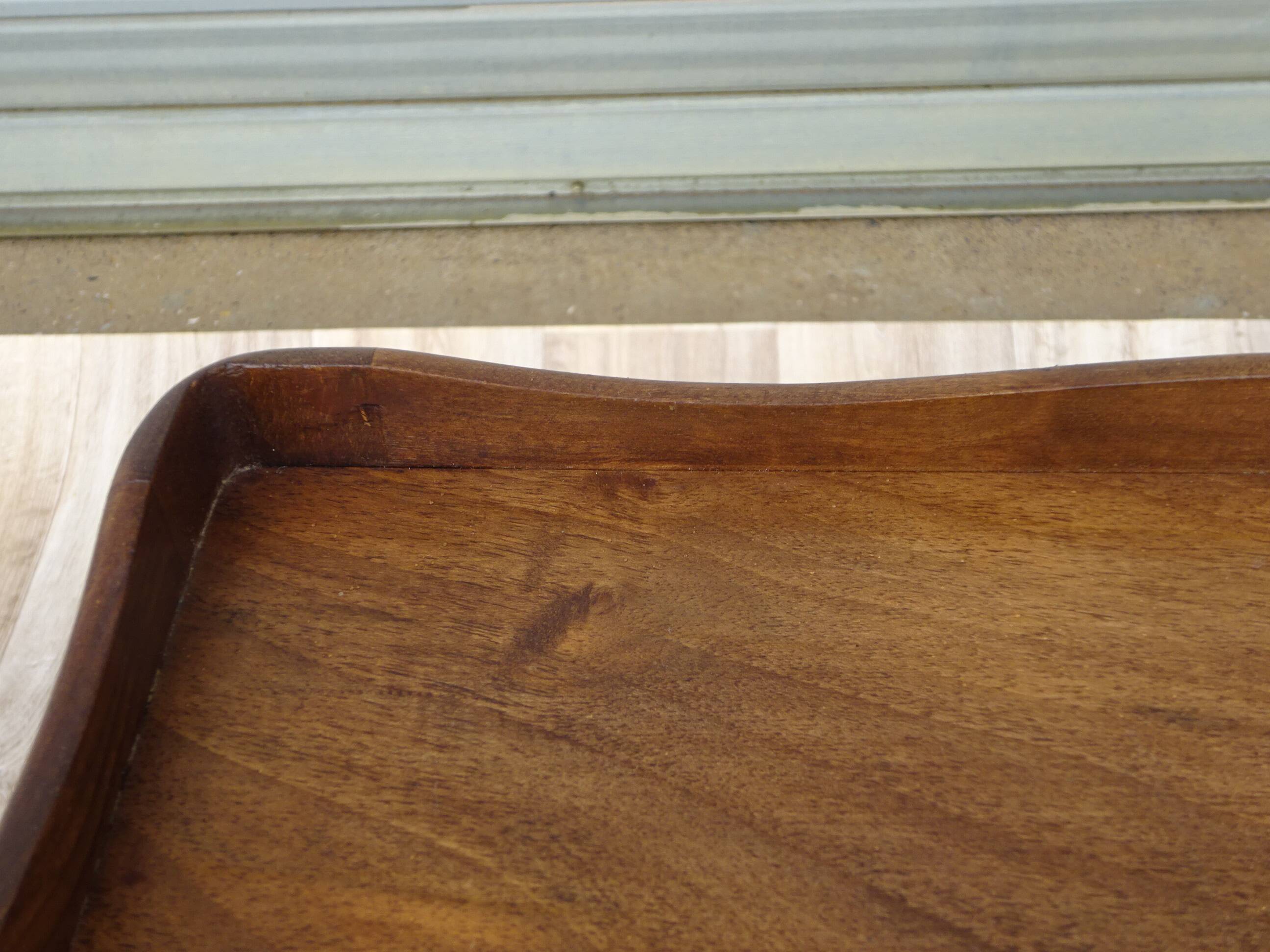 Louis XV bedside table in walnut, 3 drawers, raised edges on the tops.