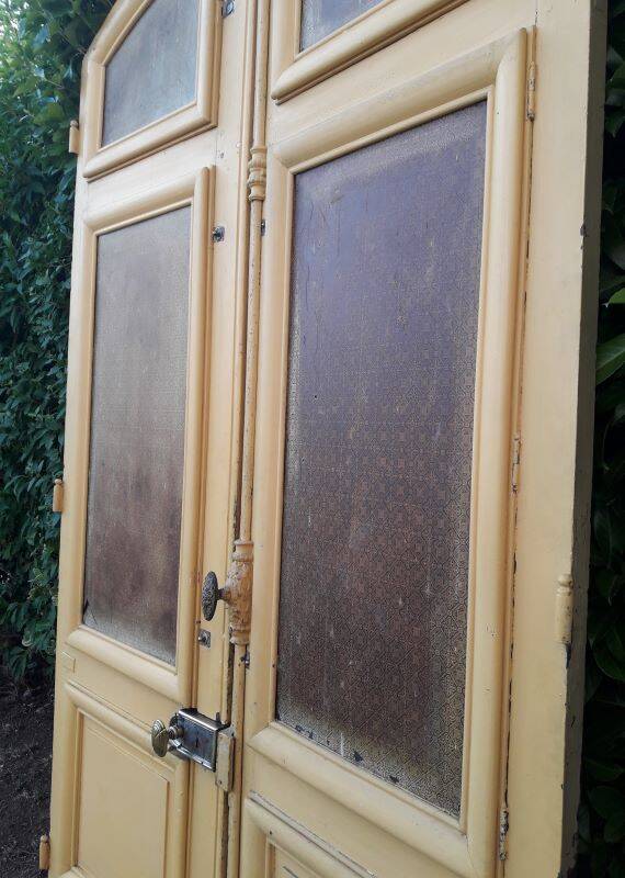 19th century double arched entrance door in oak with grilles and old glass