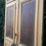 Porte d'entrée cintrée double en chêne, grilles et verre, XIXème