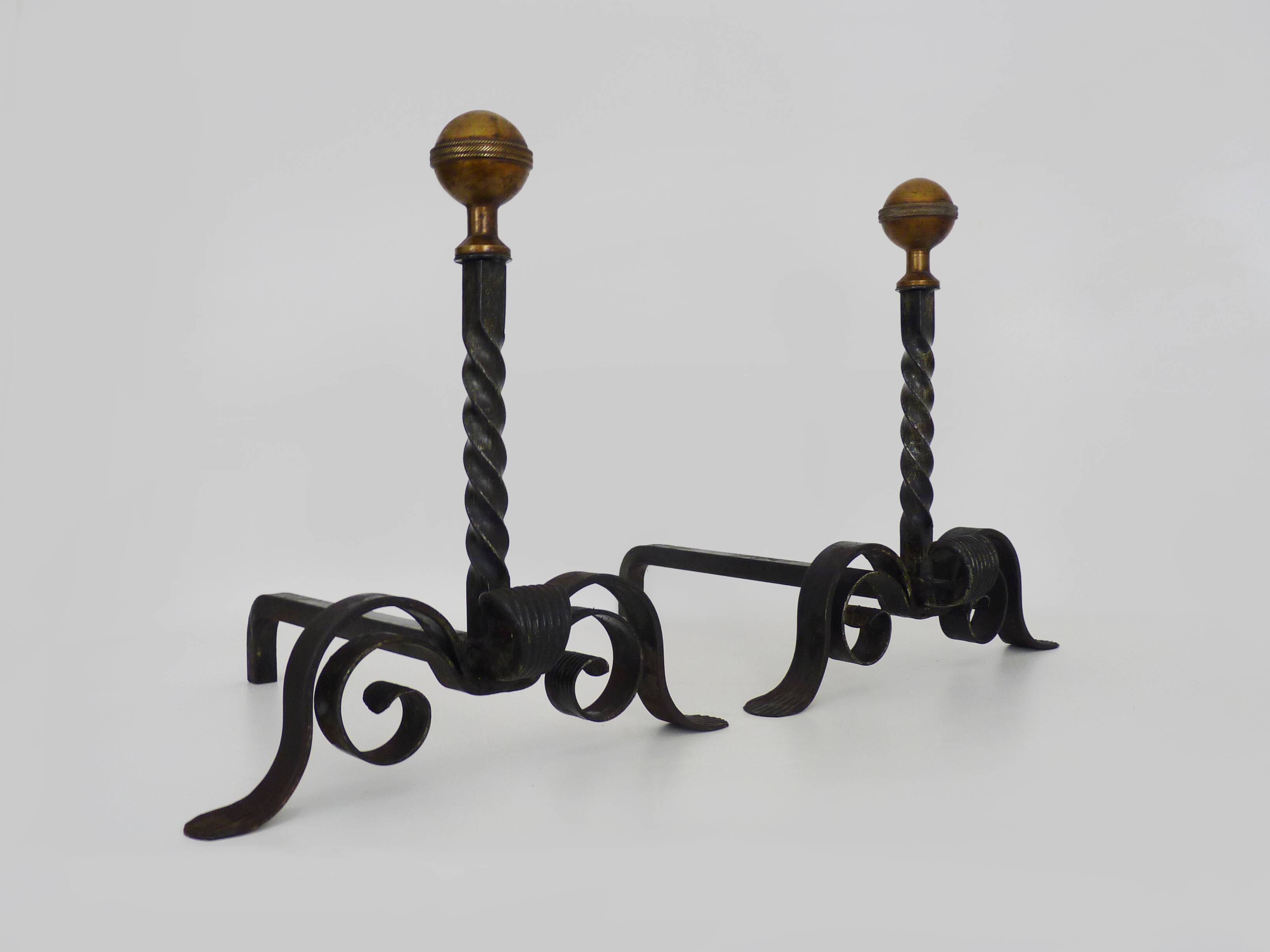 Large pair of wrought iron and brass ball fireplace andirons. 19th century