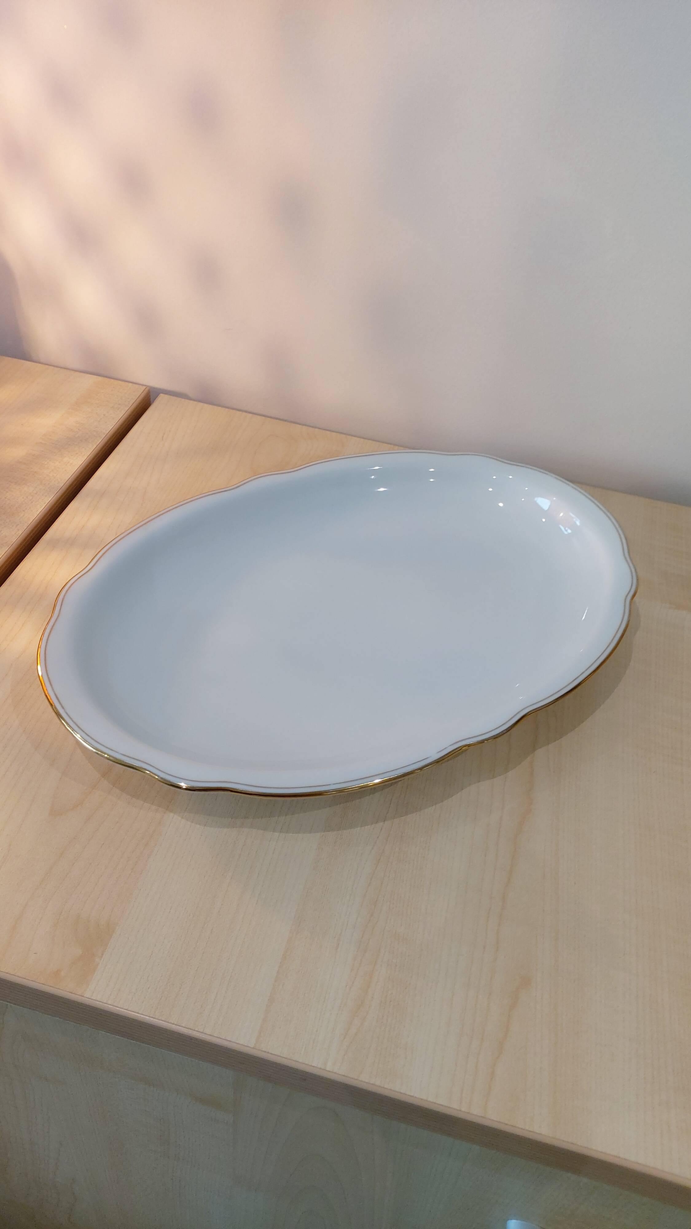 Oval porcelain plate white with gold edging