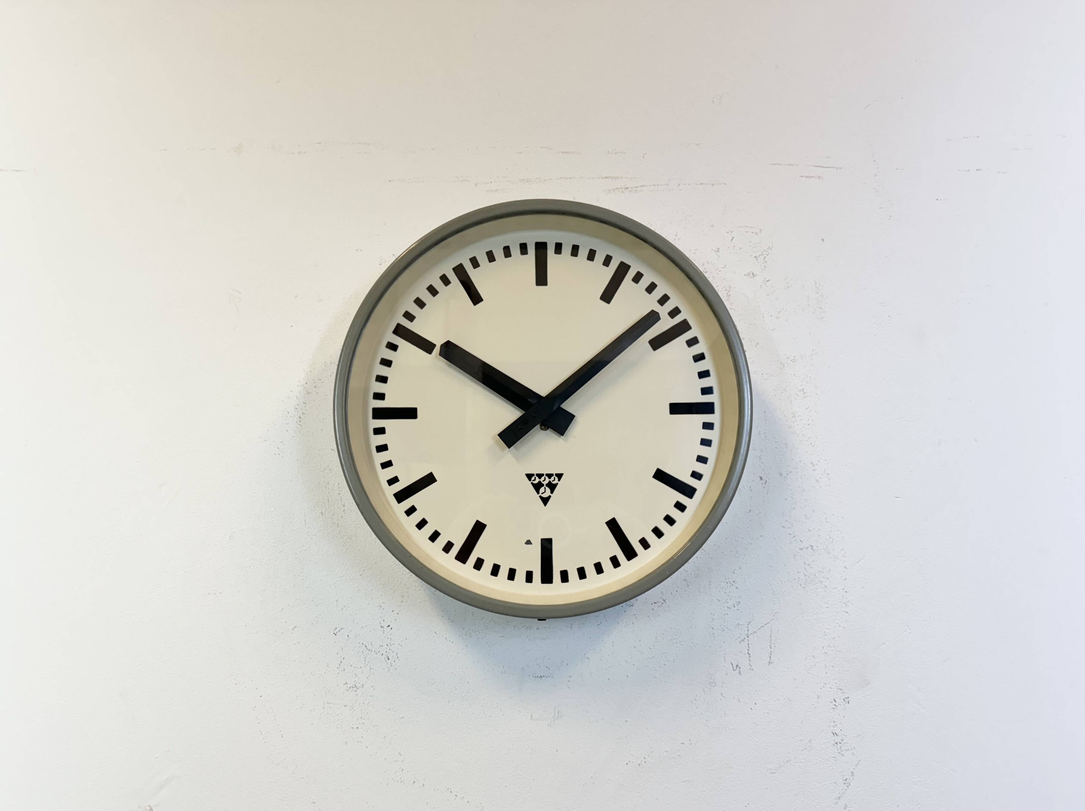Industrial grey factory wall clock from pragotron, 1960s