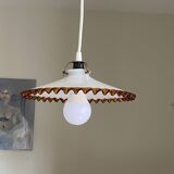 Old pendant light with a white opaline glass shade and a wavy border.