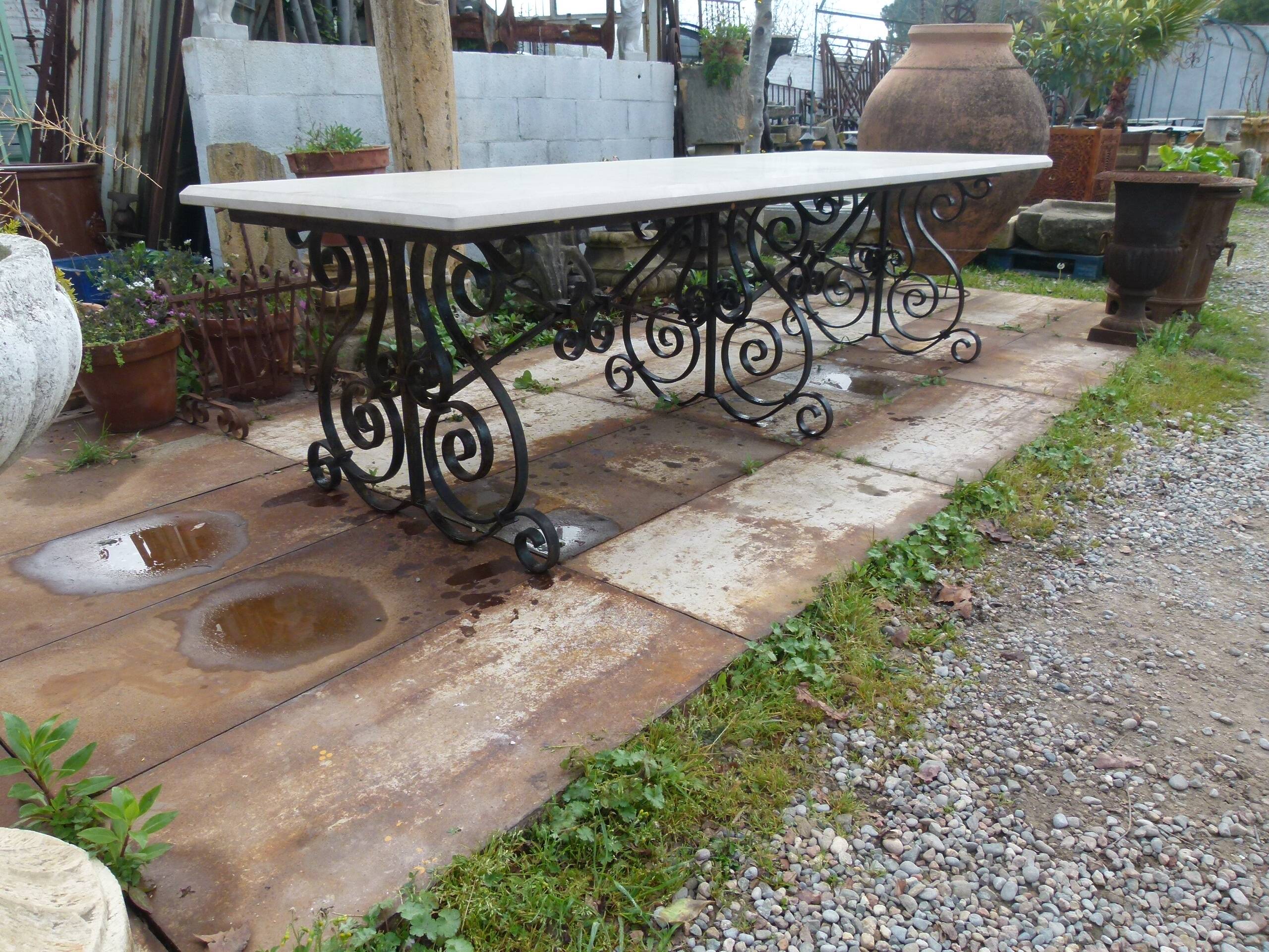 Marble table with wrought iron legs.