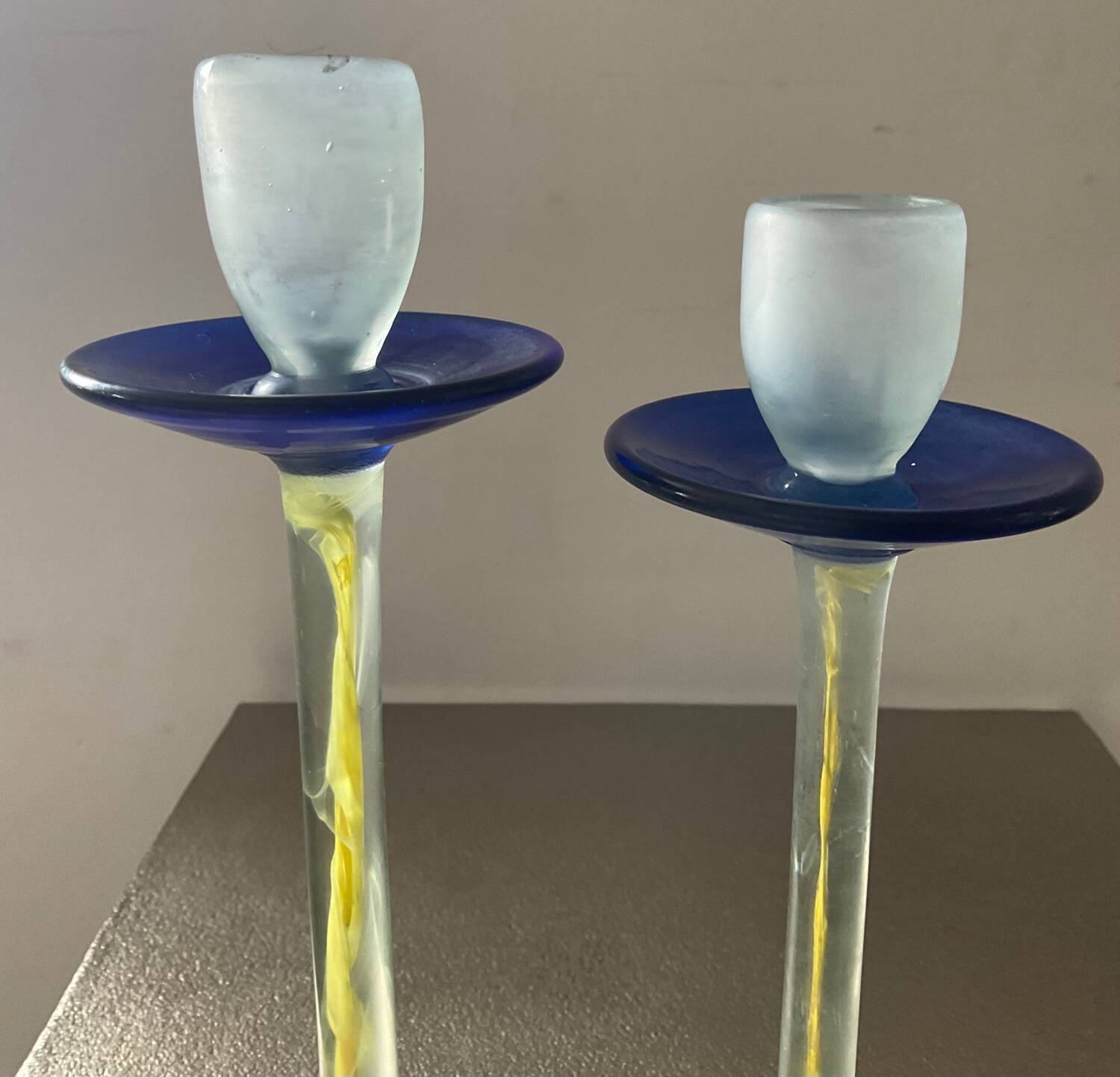 Duo of vintage Kosta Boda candlesticks in glass paste