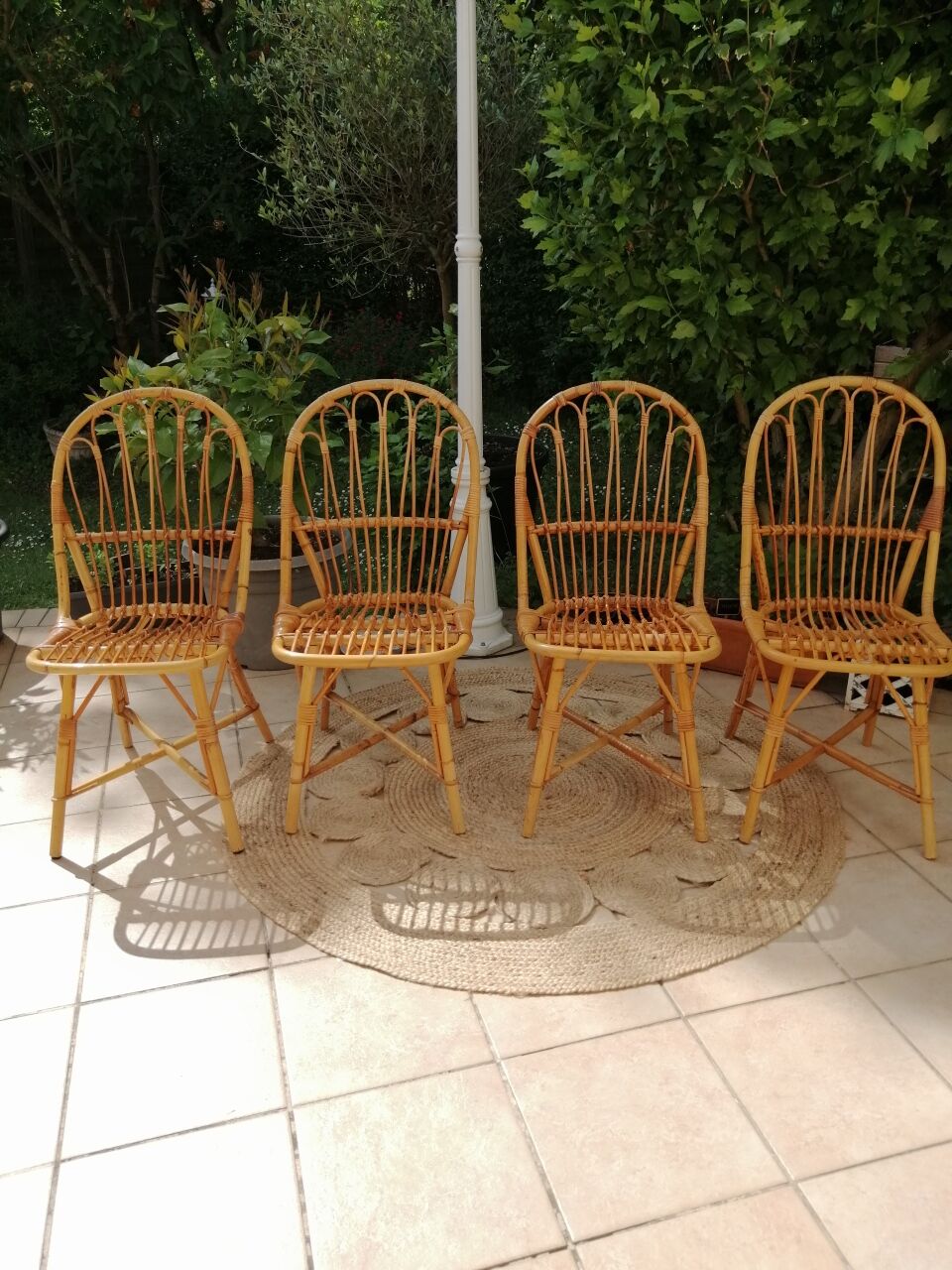 Series of 4 vintage rattan chairs.