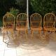 Series of 4 vintage rattan chairs.