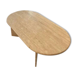 Oval coffee table in raw travertine