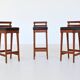 Erik Buck set of three bar stools in teak and leather Dyrlund Denmark 1960