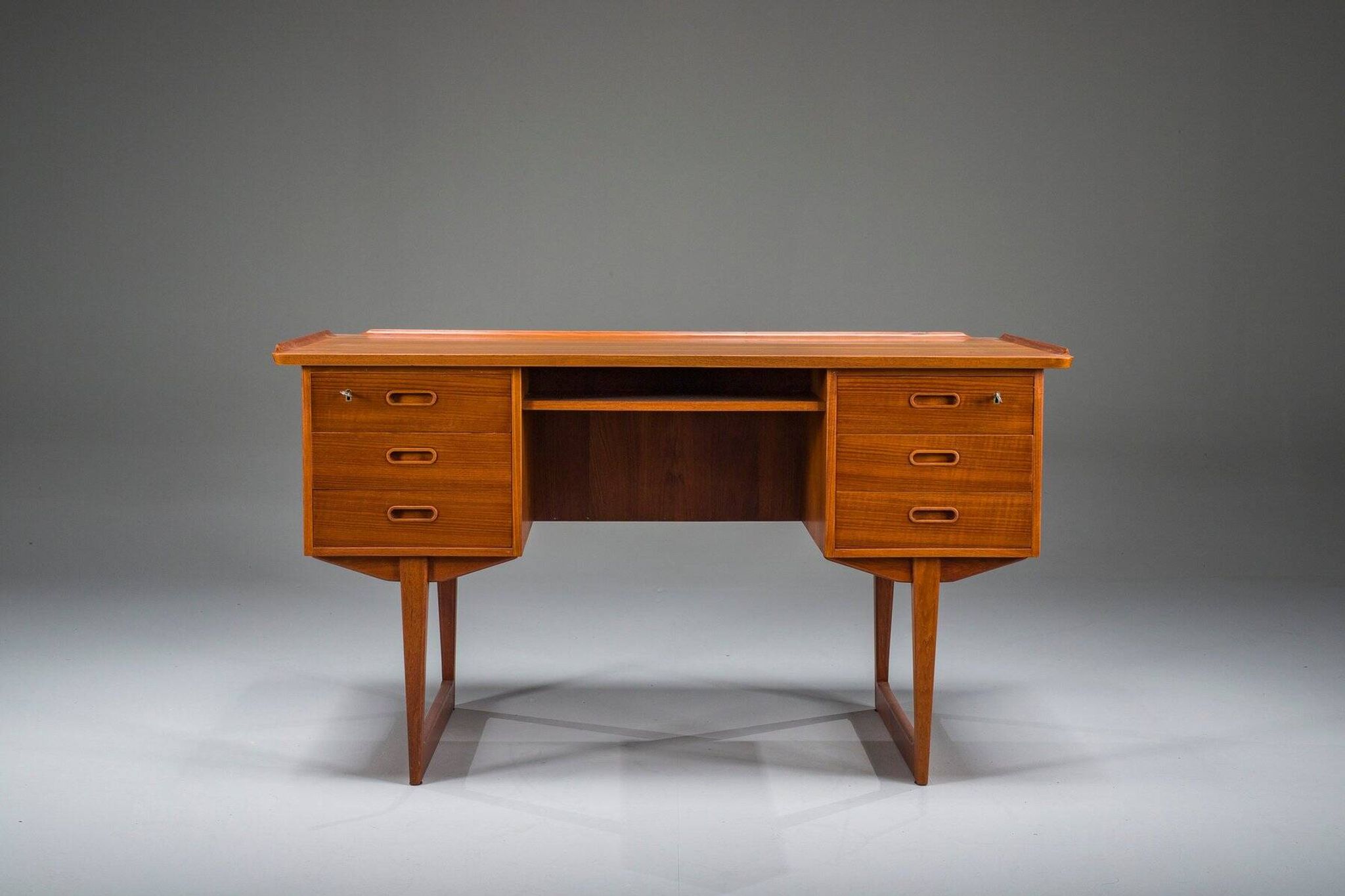 Mid-century Danish freestanding teak desk with raised lip edge, 1960s