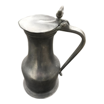 Tin pitcher with tassel patterns