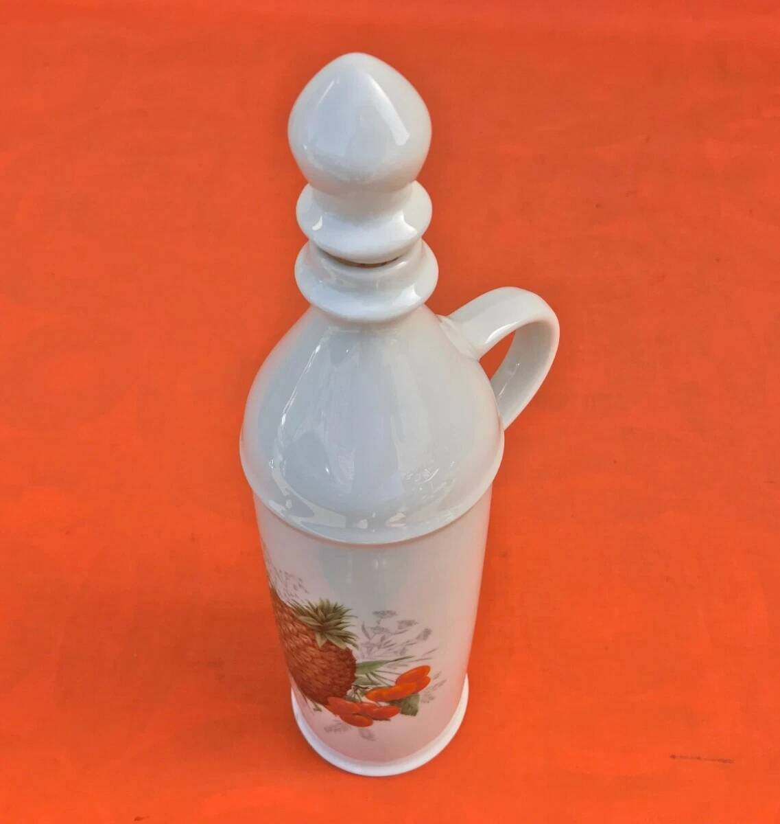White porcelain bottle with fruit decoration