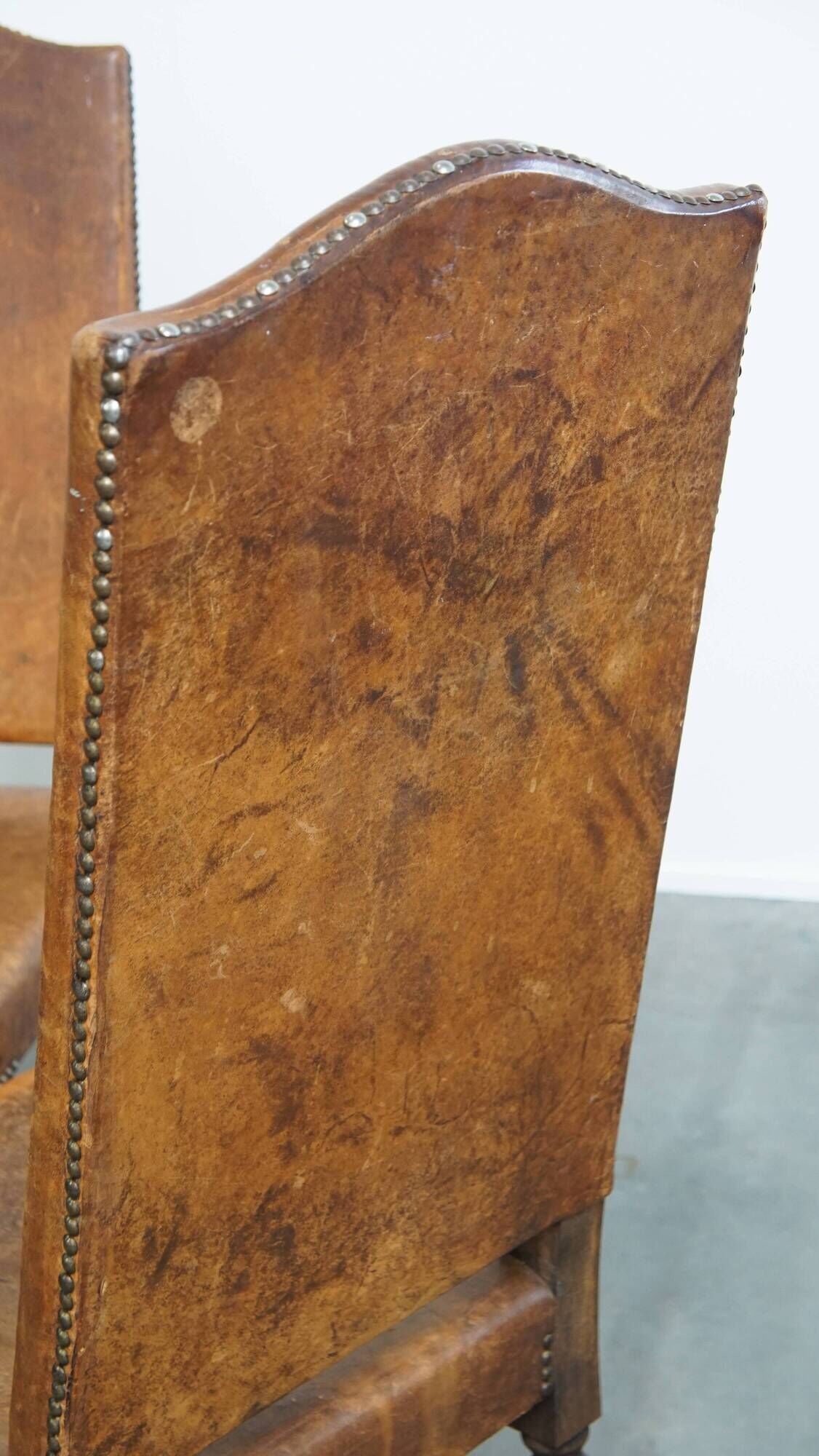 Set of 4 antique wooden and sheepskin leather dining chairs