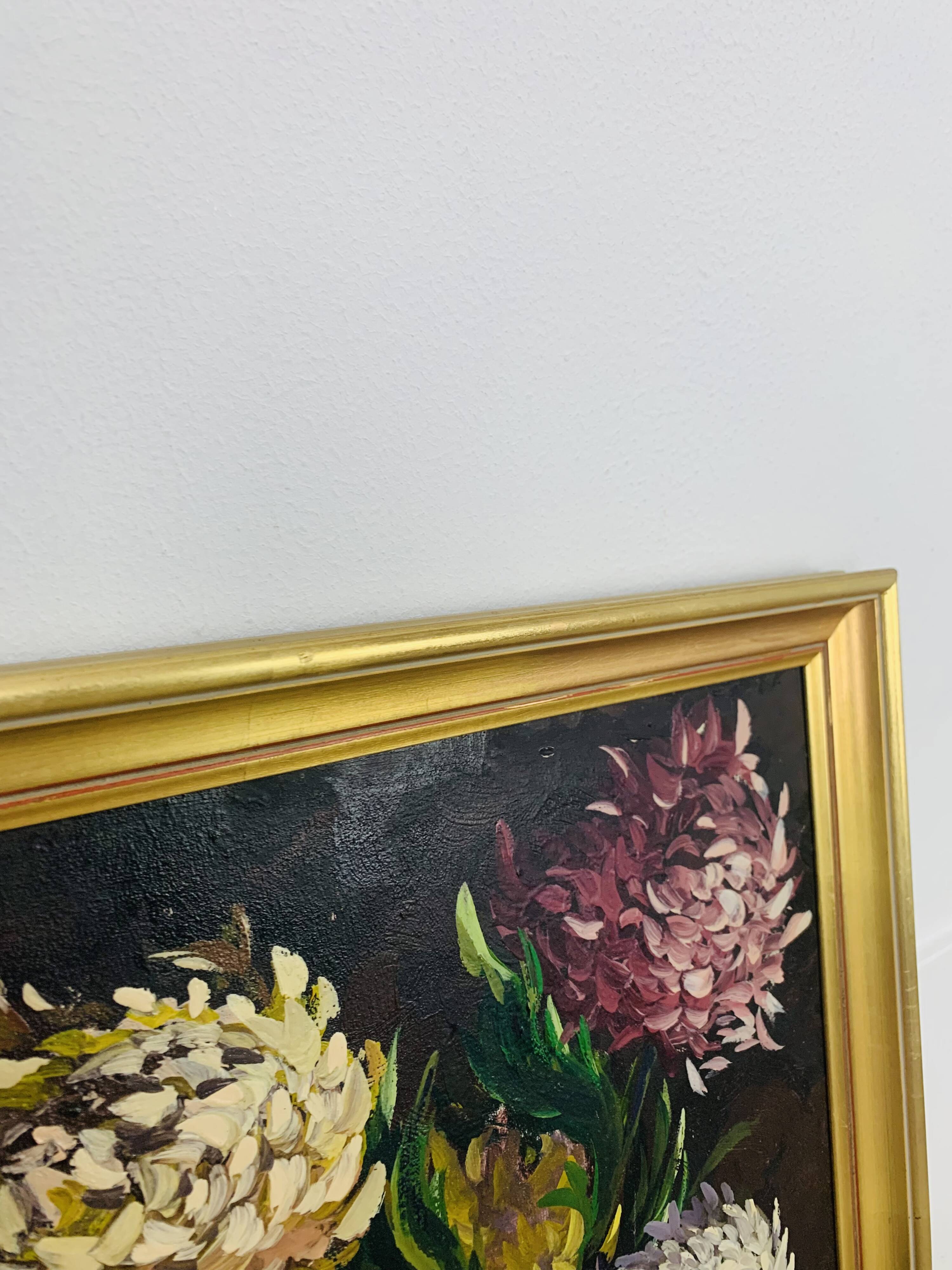 Still life painting of a bouquet of flowers, golden frame