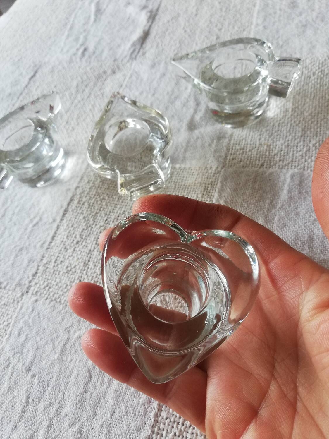 Set of four small transparent glass candle holders 3 spikes 1 heart