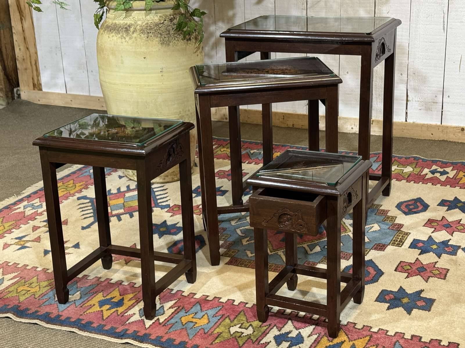 Set of 4 Chinese nesting tables in teak from the 1980s.