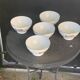 Set of 5 faceted white earthenware bowls with a naive decor, antique