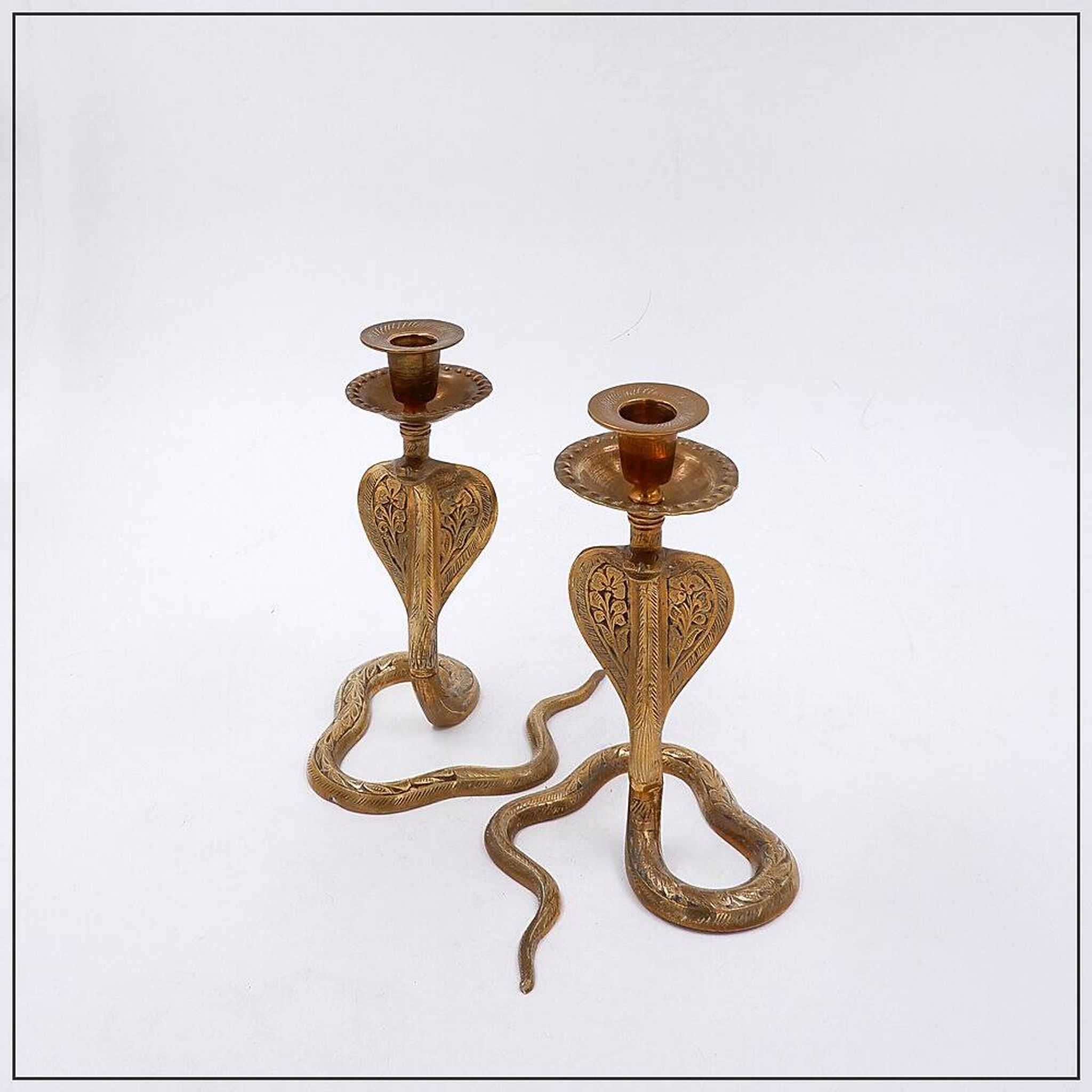 Pair of engraved brass cobra candlesticks - 1960s