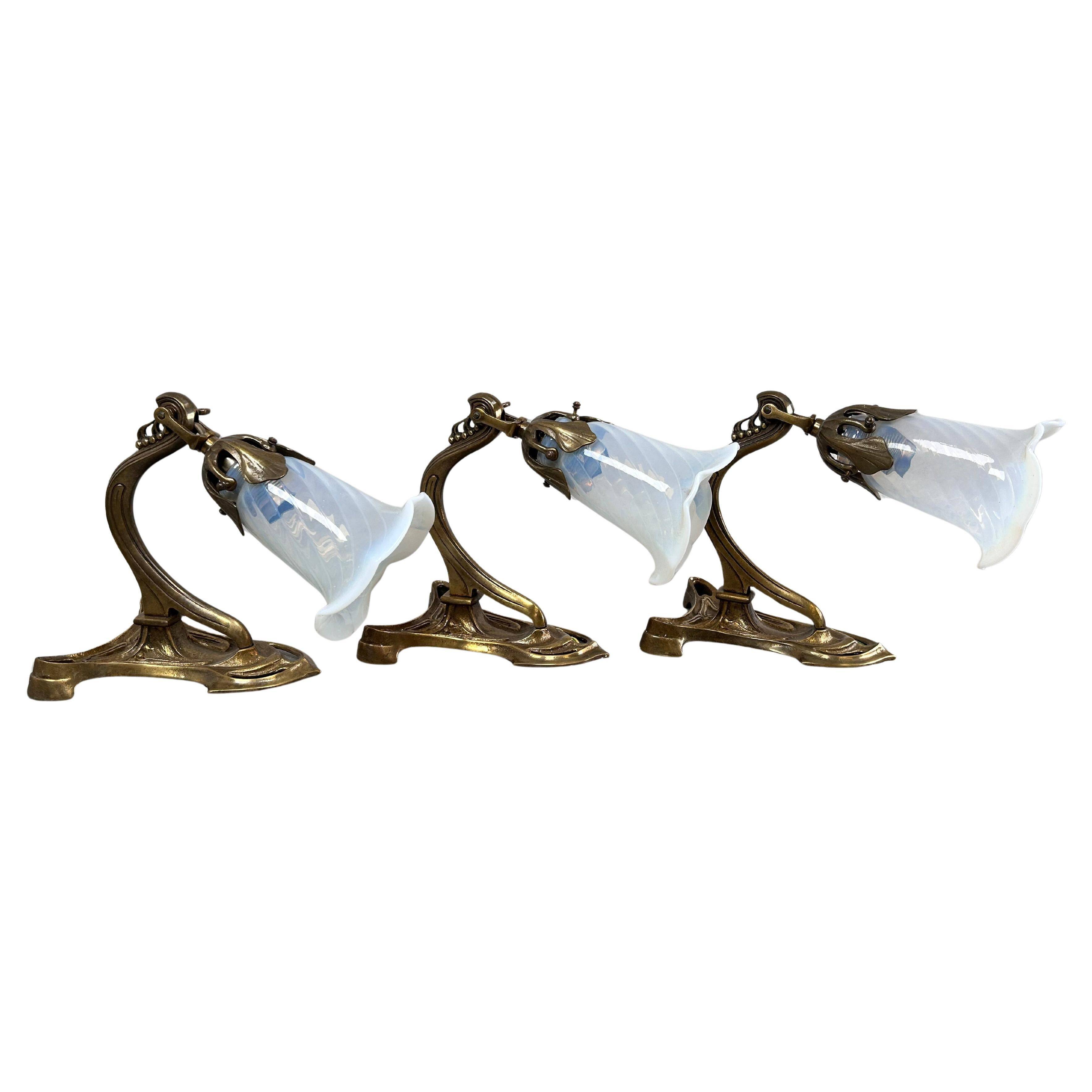 Art Nouveau wall sconces with opalescent iridescent glass