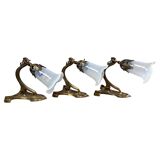 Art Nouveau wall sconces with opalescent iridescent glass