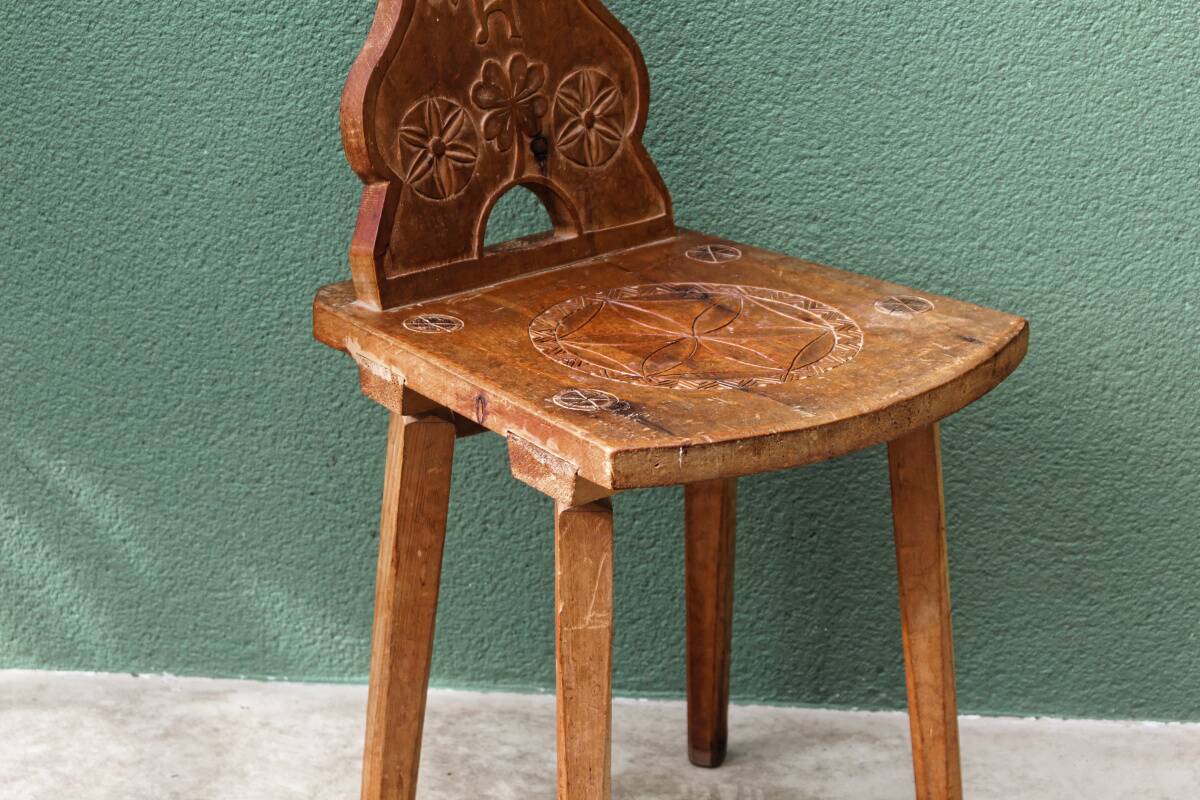 Old Swiss escabelle chair in carved wood