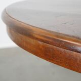 Wooden round 4-person dining table with detailed leg
