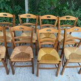 12 solid wood and straw chairs