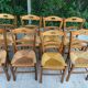 12 solid wood and straw chairs