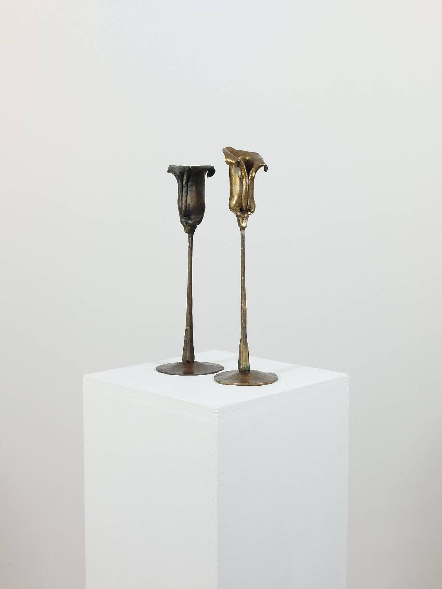Pair of vintage brass candle holders with tulip decoration.